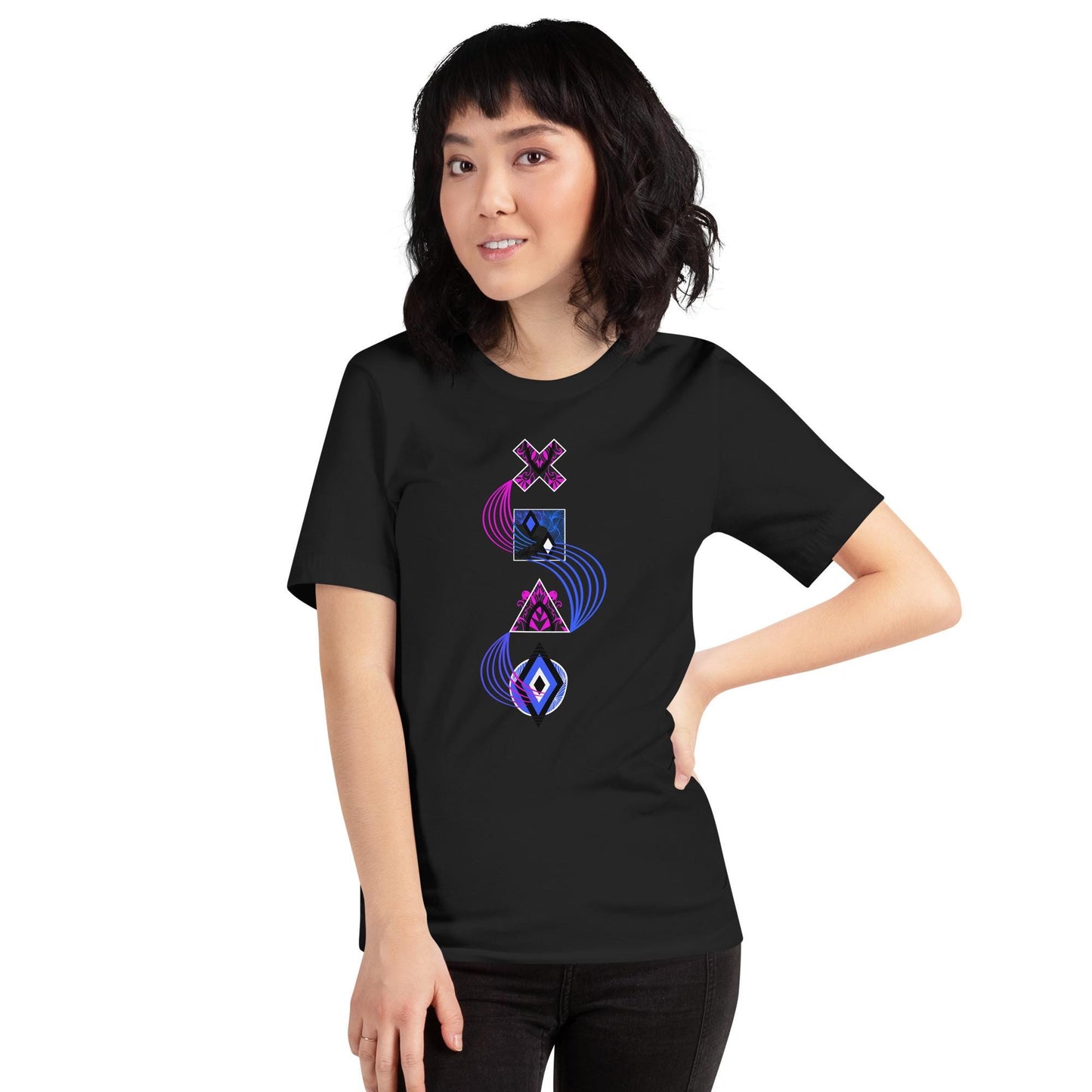 Vintage black unisex PlayStation controller symbols t-shirt with neon blue and pink swirl linking stylized cross (×), square (□), triangle (△), and circle (○) icons. Standing in front of a brick wall.